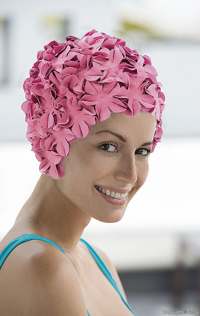 Lady wearing a pink flower swim hats - Fine Saratoga Ltd